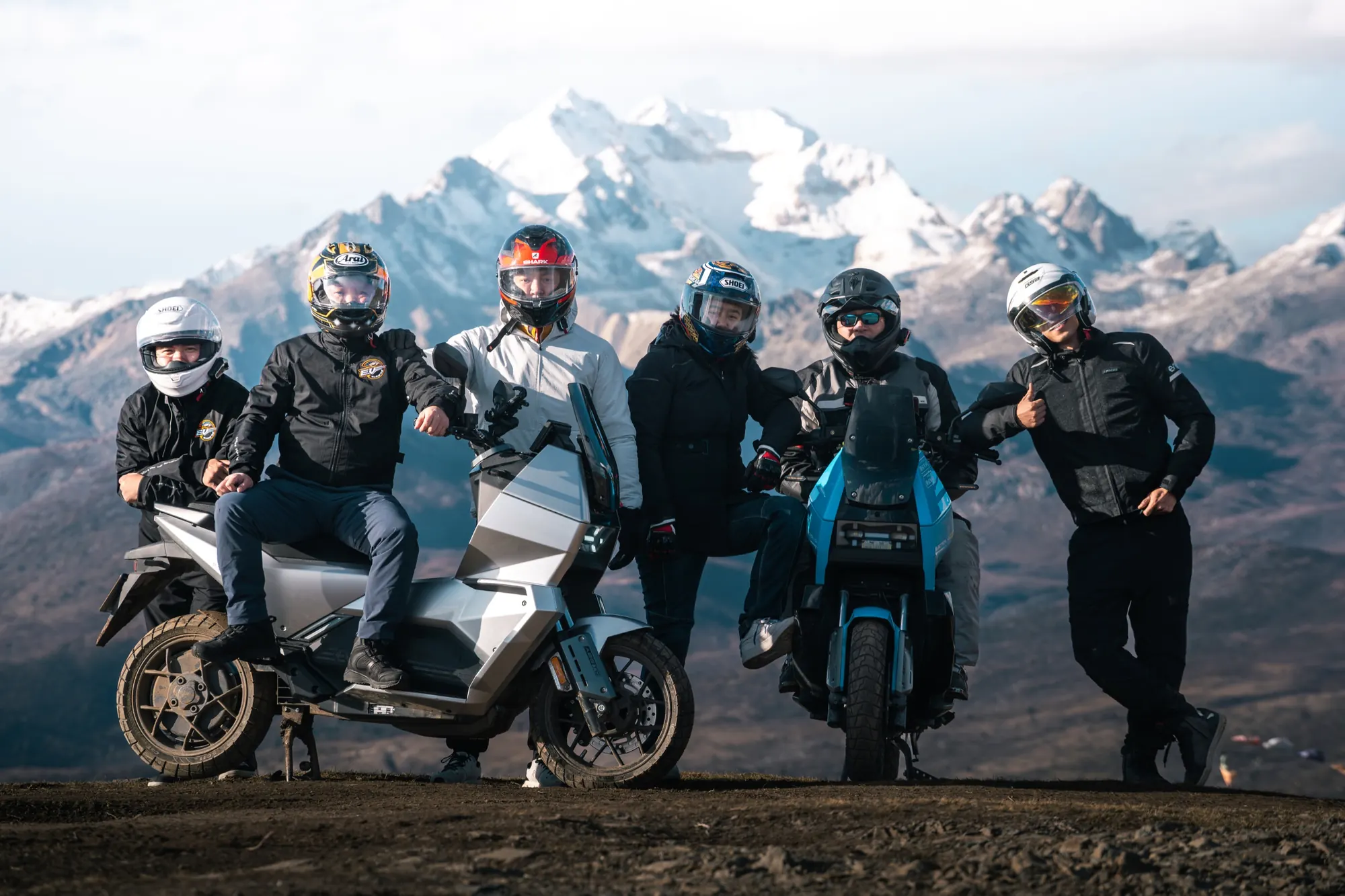 EVREV riders and team in a mountain landscape
